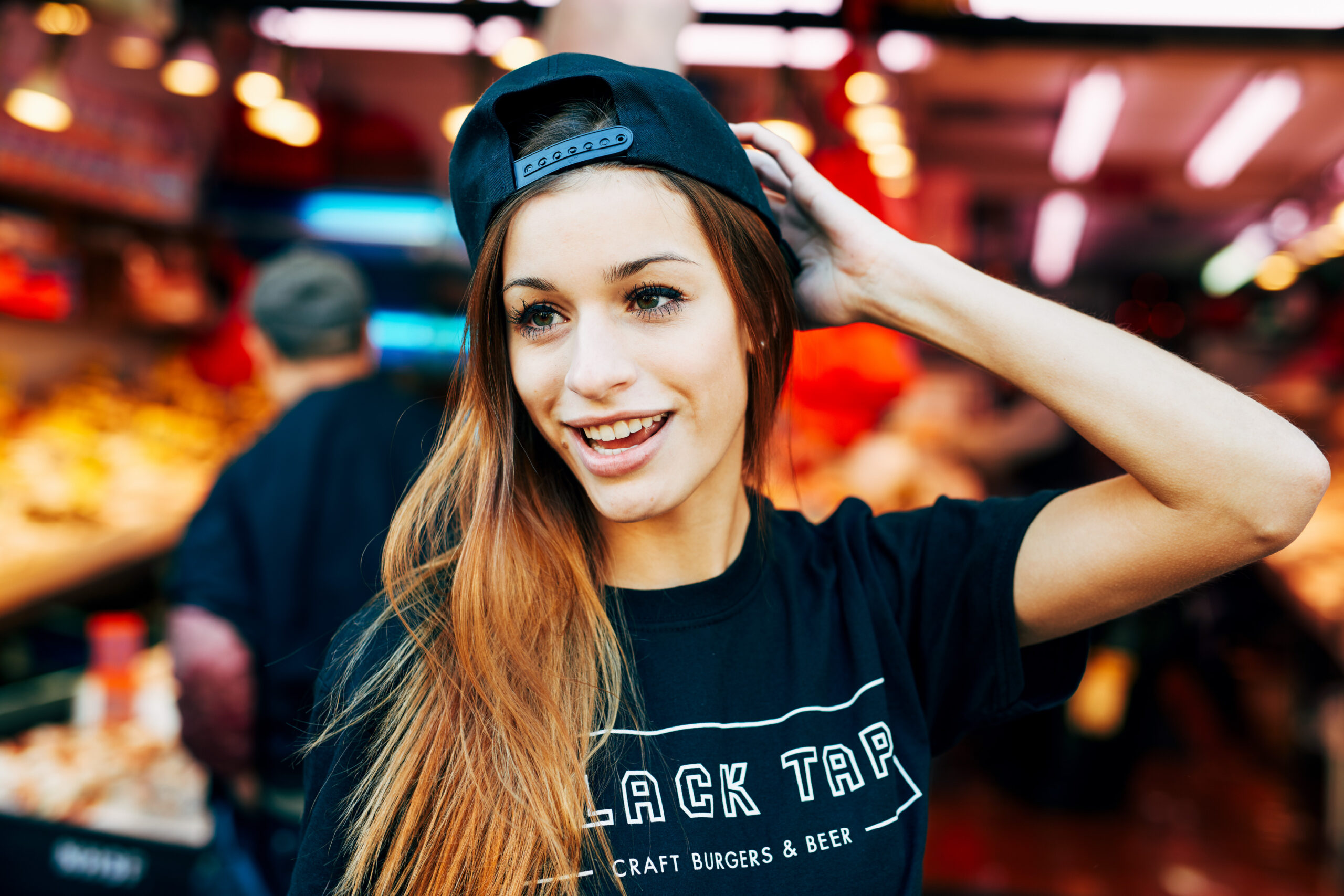 Photo of Woman in logo tee for Black Tap by Madonna+Child Creative Studio